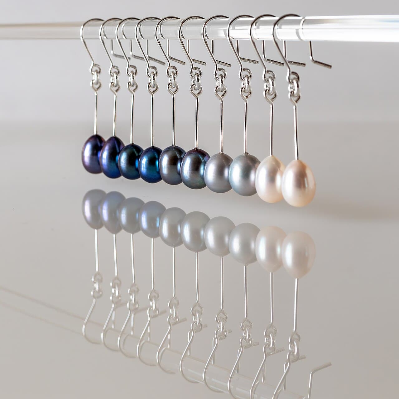 Freshwater pearl drop earrings on slim silver hooks