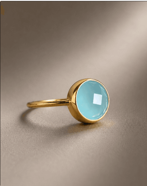 Gold ring with a round aquamarine cabochon