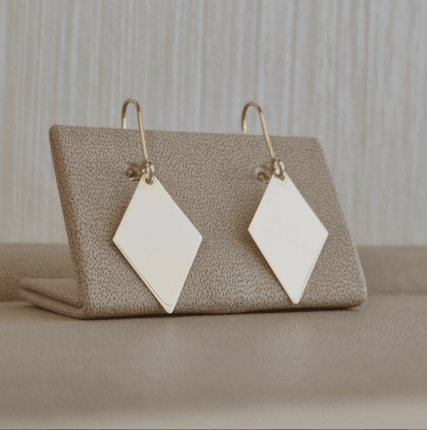 Ianthe Huggie Hoops on marble