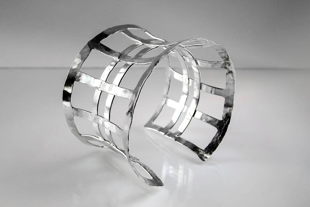Wide hand-hammered sterling silver cuff bracelet with an open lattice
