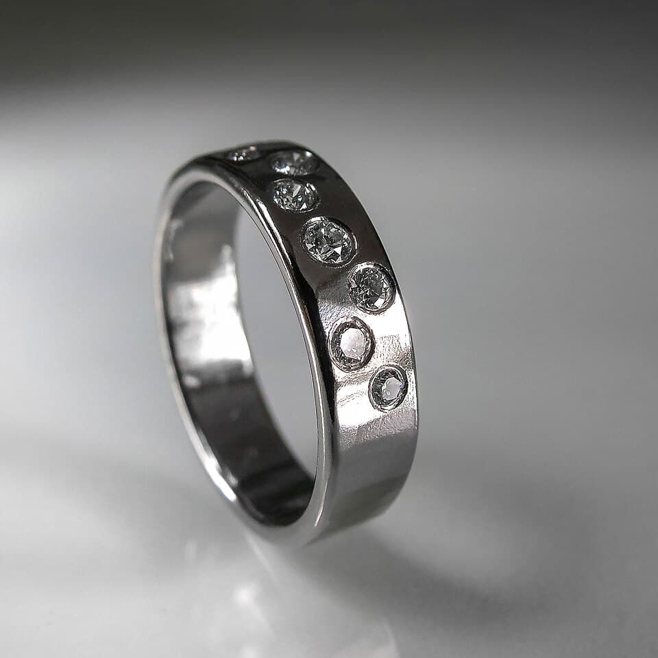 White gold band set with diamonds